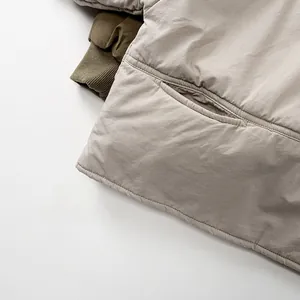 Detail view of children's cotton jacket featuring quilted seams and ribbed sleeve cuffs