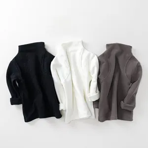 Detailed view of high-neck cotton knit undershirts in black, white and brown for kids