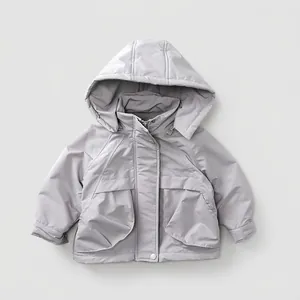 Detail view of children's fleece-lined windbreaker with large pockets and hood
