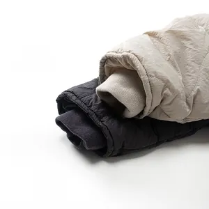 Detail of ribbed windproof cuffs on diamond quilted lightweight cotton jackets for kids