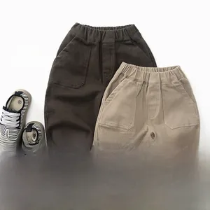 Detail of kids warm fleece trousers with elastic waist and stylish striped folded cuffs