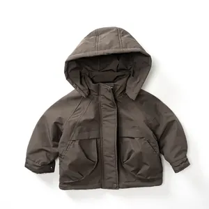 Detail view of children's fleece-lined mocha windbreaker with hood and large utility pockets