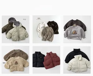 Flat lay of diverse children's winter fleece jackets and hoodies in earthy tones