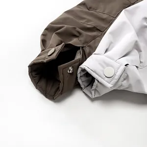 Detailed shot of windproof jacket cuffs with cozy fleece lining and snap button closure