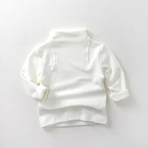 Detailed view of kids white turtleneck base layer with soft cotton rolled cuffs