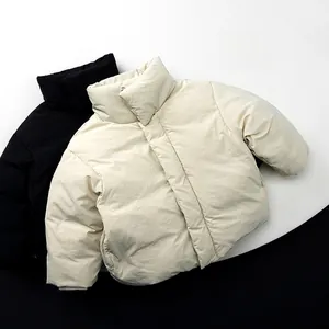 Detail view of thickened windproof stand-up collars on black and beige kids down jackets