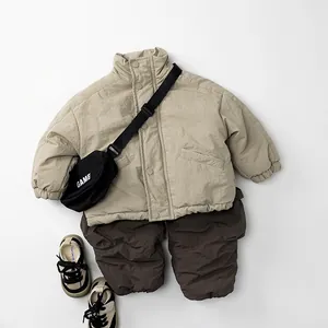 Flat lay of kids winter fleece-lined beige jacket and dark brown textured joggers set