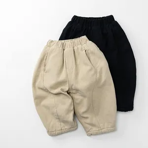 Detail of high-elastic waistband and thick fleece fabric on kids winter thermal pants