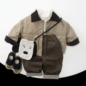 Kids warm fleece khaki jacket and brown trousers set with a white dog knitted bag