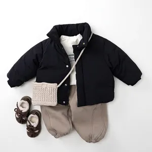 Minimalist kids winter down jacket set with black coat, khaki pants and boots
