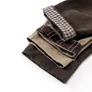Kids warm fleece-lined corduroy pants in earthy tones with stylish plaid cuff details