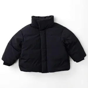Detail of kids black down jacket with stand-up collar and ribbed windproof cuffs
