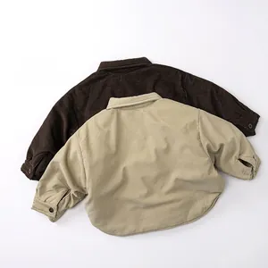 Detail view of thickened corduroy kids shirts in coffee and beige with vertical textures