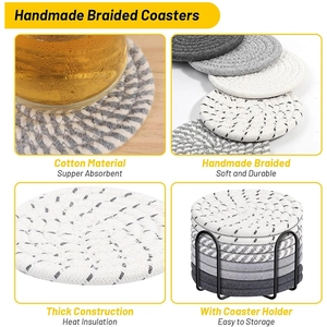 Detail of handmade braided cotton coasters in various colors with a black metal holder