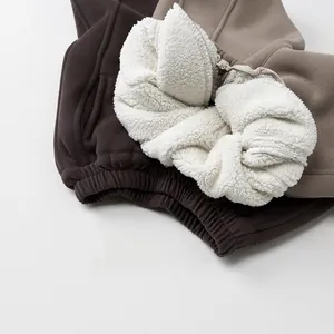 Close-up of thick sherpa fleece lining inside kids warm winter jogger pants