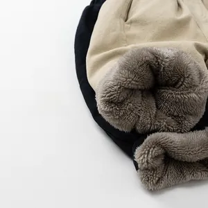 Close-up of thick grey faux sherpa lining on winter warm trousers for kids