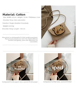 Detail view of a woven straw envelope bag featuring a cute bear pattern and thin shoulder strap
