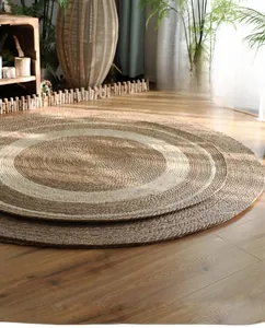 Close-up of circular woven jute rug with natural texture and two-tone spiral design