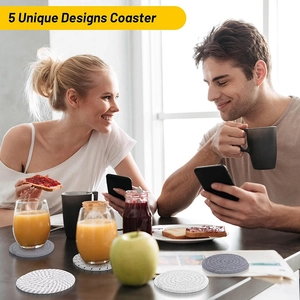 Lifestyle shot of breakfast scene with 5 unique designs of woven cotton coasters on table