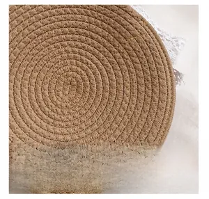 Detailed close-up of woven round shoulder bag with spiral texture and white lace trim edge