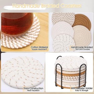 Detail of braided cotton coasters set with metal holder on a warm wooden tabletop