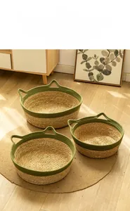Detailed macro view of handmade woven grass cat beds with green rope ears for pets