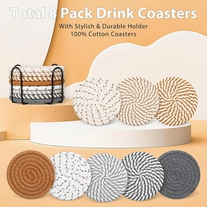 Detailed macro view of 8-pack cotton woven coasters with a sleek black metal storage holder