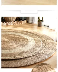 Detail view of the circular jute rug showing natural woven texture and rustic spiral patterns