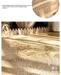 Detail of hand-woven natural straw rug showing intricate spiral texture and fiber patterns