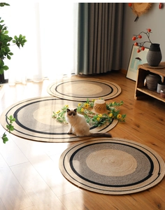Close-up of hand-woven cotton round rugs with natural texture and circular patterns