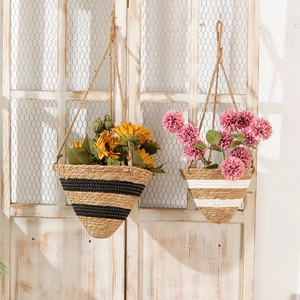 Handwoven Nordic wicker hanging planter basket with natural jute rope and striped patterns