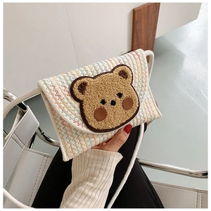 Handheld woven crossbody bag with cute 3D plush bear patch and colorful stitching