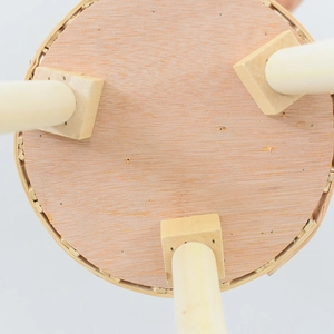 Detail view of the wooden stand legs and square joint base on the minimalist planter