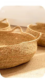 Close-up of hand-woven natural rattan cat bed showing durable wicker texture and handle
