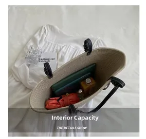 Spacious interior of beige cotton woven tote showing tablet, umbrella and water bottle