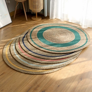 Nordic woven natural seagrass rug with colorful circular patterns for home decor