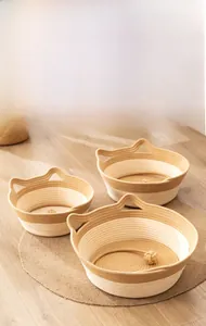 Detailed view of woven cat beds in three sizes with cute cat-ear shaped handles