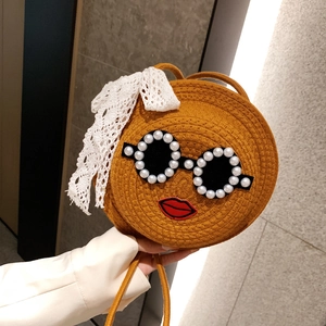 Cute round woven straw crossbody bag with funny sunglasses face and lace bow detail