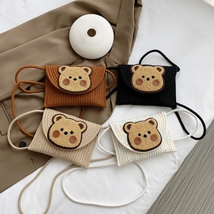 Handmade woven mini bear shoulder bags in brown, black, and beige colors for kids