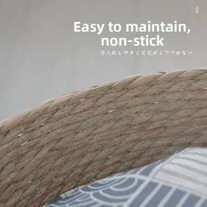 Detail of hand-woven cat bed featuring natural fibers and easy-to-clean blue wave cushion