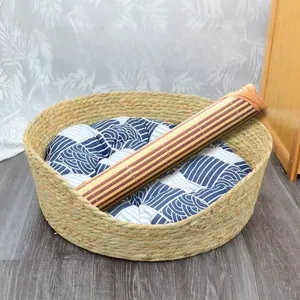 Detailed view of woven cat bed set with bamboo mat and patterned cotton cushion