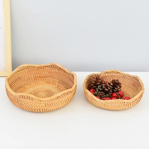 Detailed macro view of wave-edge woven rattan storage baskets in natural brown texture