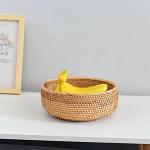 Macro detail of natural handmade rattan basket weaving with fresh bananas inside
