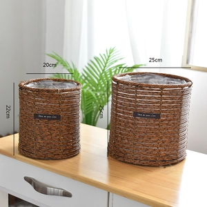 Detailed view of woven seagrass plant baskets with waterproof lining in two sizes