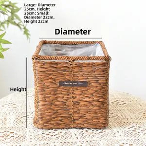 Detail of square woven plant basket with waterproof plastic lining and leather patch