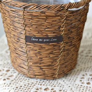 Detailed macro view of woven flower basket with leather tag and plastic lining