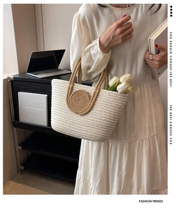 Close-up of woven tote bag with contrast colors and stylish circular handle detail