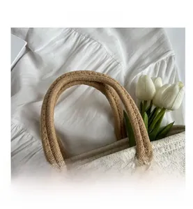 Close-up of comfortable woven tote bag handles with elegant golden sequin accents