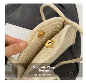 Detail view of the magnetic closure and cotton rope weave on this beige shoulder bag