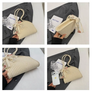 Detail view of woven beach bag with lace bow, floral embroidery and phone size comparison
